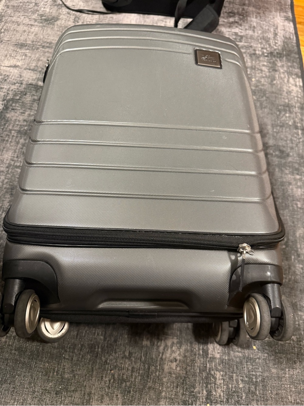 Unixes Gray Hard-Shell Spinner Carry-On Luggage from Macy’s wads $160